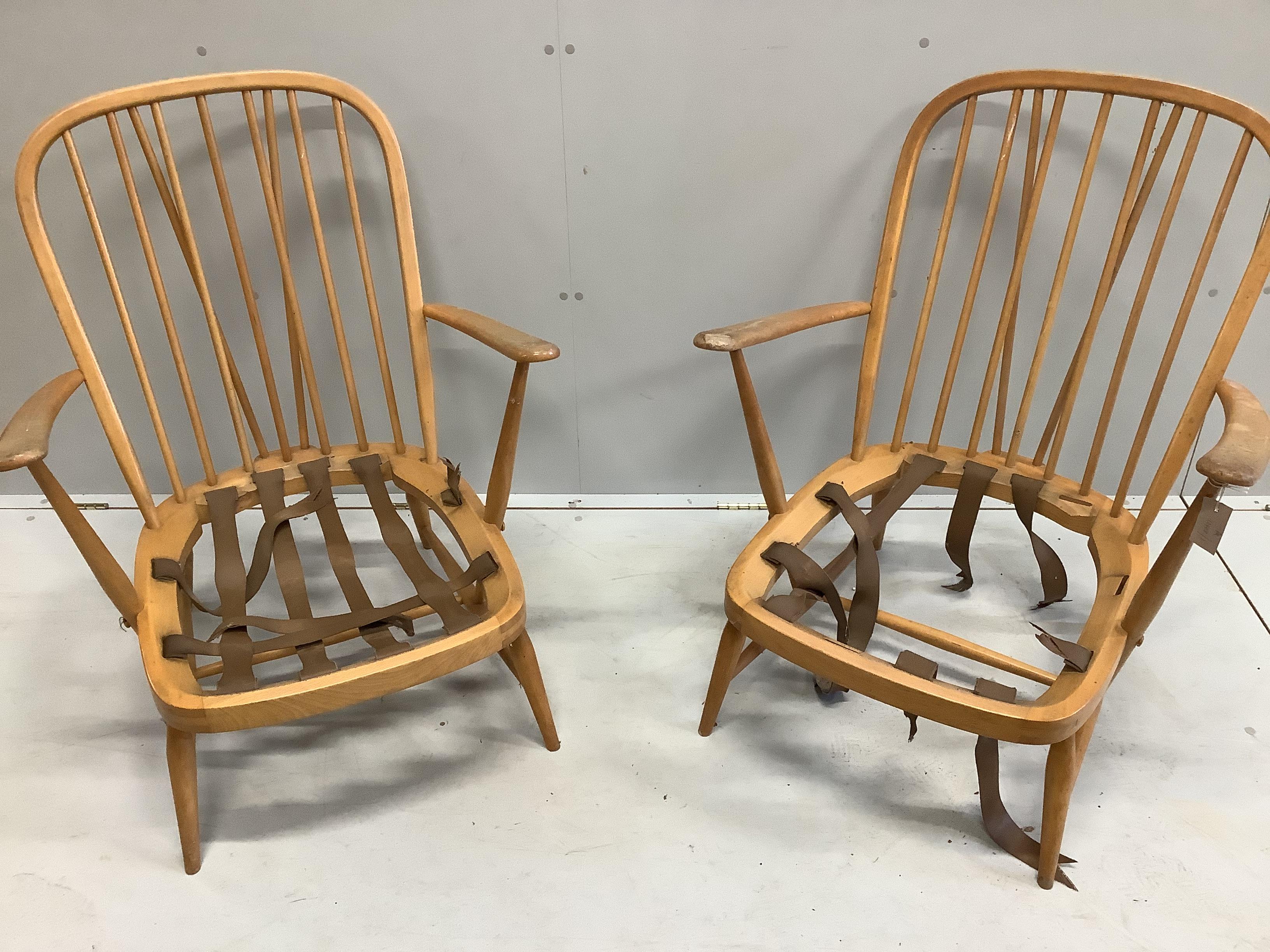 A pair of Ercol beech armchairs, width 70cm, depth 78cm, height 86cm